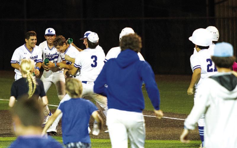 Badgers storm the field and surround Dylan Peak after his at-bat resulted in a walk-off win for the team in Thursday’s game one against Giddings. Lampasas topped the Buffaloes in the best two of three series, and now move on to the third round of the playoffs. For more details on the action, see Sports on page 6. HUNTER KING | DISPATCH RECORD