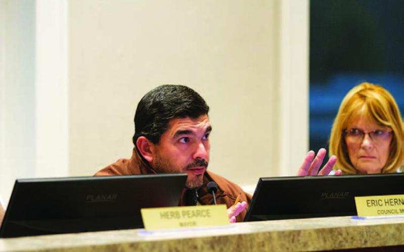 Lampasas City Councilman Eric Hernandez questions the 2Q Ranch Productions representative about its request for hotel-motel tax funding for upcoming events. Also pictured is Councilwoman Dorothy Person. HUNTER KING | DISPATCH RECORD