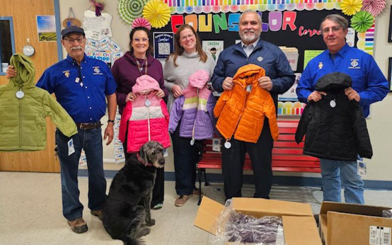 At Hanna Springs Elementary School, the Knights of Columbus brought 24 coats for students who might need them this winter. Pictured are, from left, Bacillio Zamanegio, Principal Lindsay Duhon and school counselor Carisa Brown, with Jess Ramos and Rey Medrano. jim tracy | courtesy photo
