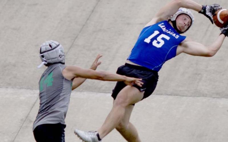 Case Brister goes up to catch a pass during 7-on-7 competition over the summer. FILE PHOTO