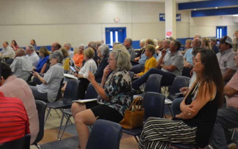 More than 80 parents and residents listened to a solar farm presentation inside the middle school cafeteria Wednesday evening. All who spoke during the open forum session were opposed to the proposal. MONIQUE BRAND | DISPATCH RECORD
