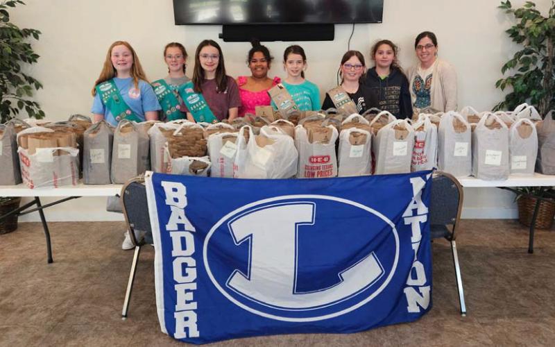 Scouts who worked to pack and sort all the eclipse gift bags are, from left, Troop members Anna Figurski, Jenna Paige Linney, Rylie Wood, Vera-Rose Johnson, Emma-Lee Bull, Isabella Glowinski, Kenzi Rodriguez and leader Torie Lesley. courtesy photo