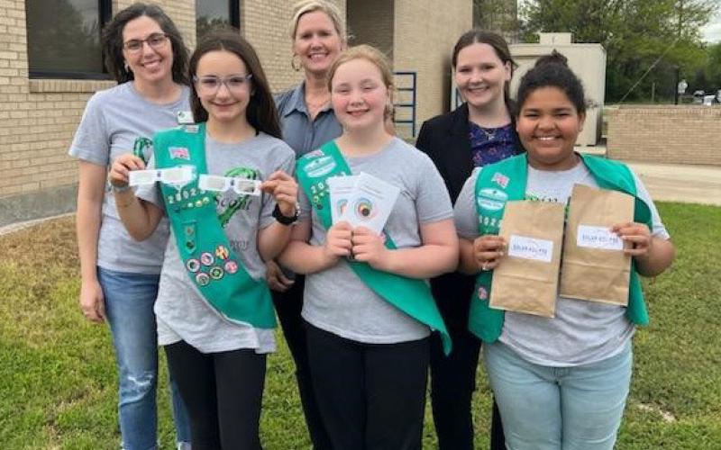 First Texas Bank partnered with Girl Scout Troops 20001 and 20023 to provide eclipse-related items to local students. Front row, left to right, are Rylie Wood, Anna Figurski and Vera-Rose Johnson, who helped head up the community service project. In back are Scout Leader Torie Lesley with First Texas Bank representatives Annie Trotter and Torie Palmer. courtesy photo