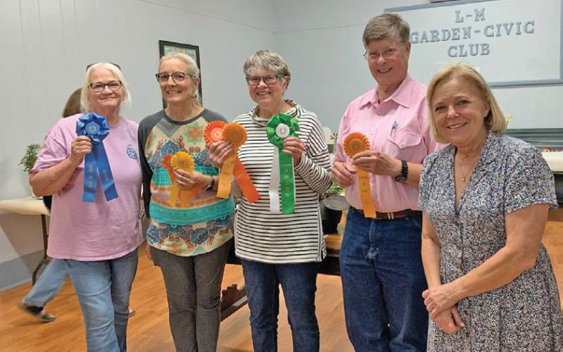Lometa L-M Garden Club held its annual Flower Show last week. Show winners, from left, are Teresa Stewart, who took Best in Show for Design; Tico Hicks, who received two Awards of Merit; Lewvon Hicks, who also captured two Awards of Merit and was named Best in Show; Sue Anderson, with one Award of Merit; and Sheri Stone, who served as judge this year. val cash | courtesy photo