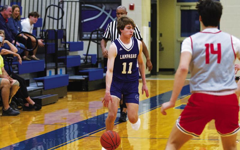 HUNTER KING | DISPATCH RECORD Jax Pratus dribbles up the floor during the Badgers’ live quarter against Hyde Park.