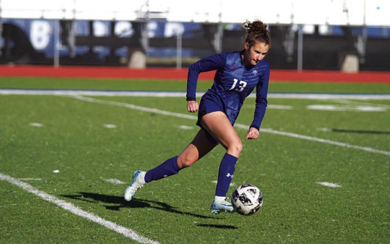 Alice Stubbs dribbles across the field during Tuesday’s match. HUNTER KING | DISPATCH RECORD