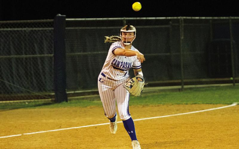 HUNTER KING | DISPATCH RECORD Kamryn Kothmann throws across the diamond from third base.