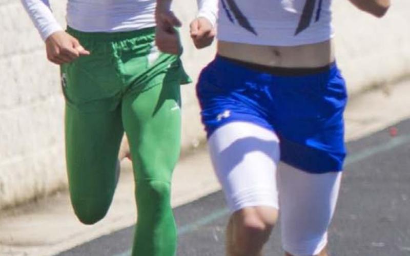 Cody Hinson beats a Burnet runner in the 400-meter dash for a silver medal on Thursday. Lampasas is scheduled to compete in the district meet in Brownwood March 31-April 1. JEFF LOWE | DISPATCH RECORD
