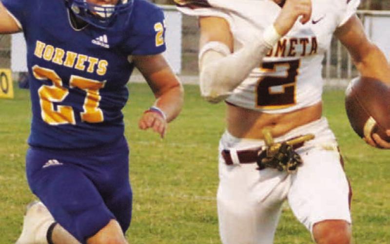 MASON HINES | DISPATCH RECORD Stone Carr-Jones finds space along the sideline during a run. He finished the game with 230 rushing yards and four touchdowns.