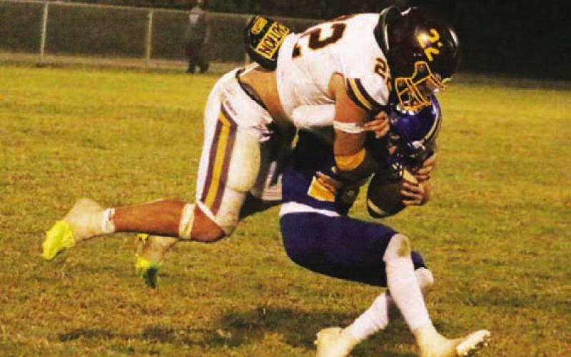 MASON HINES | DISPATCH RECORD Lukas Smailus-Cruz smothers a Rochelle ball carrier during Lometa’s win last Friday.