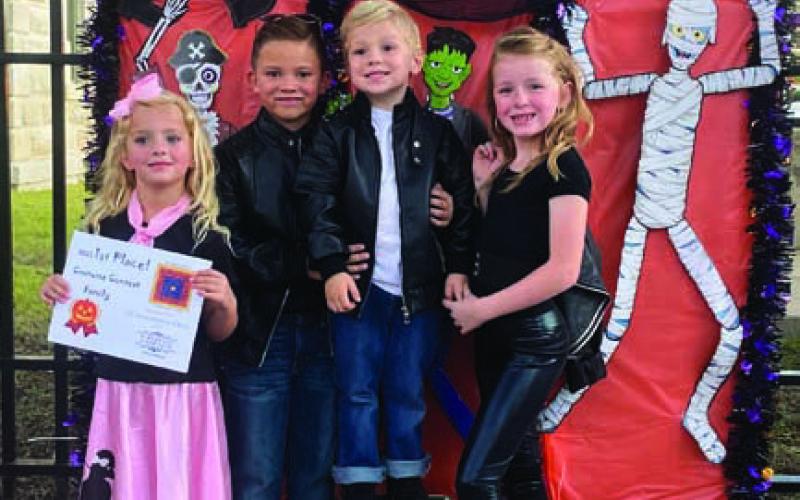 Dressed as the T-Birds from “Grease,” the Long family earned first place in the costume contest’s family division. COURTESY PHOTO