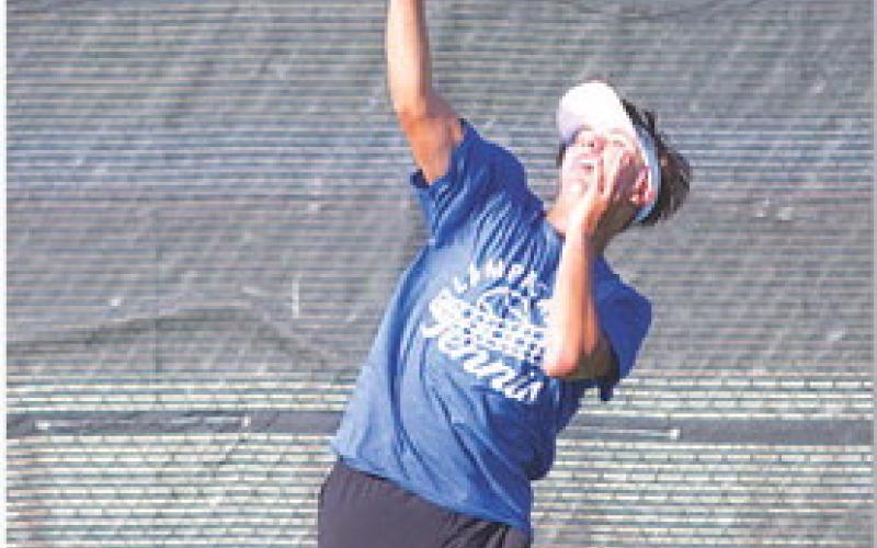 HUNTER KING | DISPATCH RECORD Clyde Ashfield serves during his singles match last week.