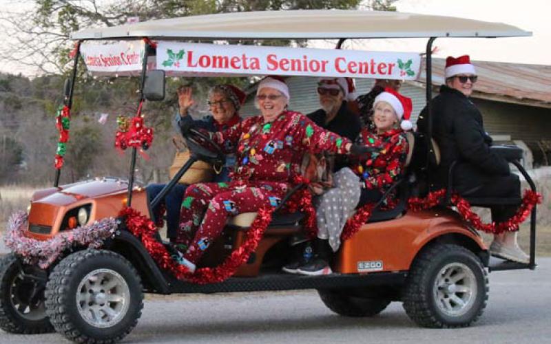 Volunteers with the Lometa Senior Center showed their Christmas spirit with a float in the Lometa “Jingle and Mingle” parade. Front row, left to right, are Vondell Stewart and Shirley Hayes; second row, Ron Hayes and Terri Corbin; and third row, Tracy Hayes and Gail Eltgroth. Mason Hines| dispatch record