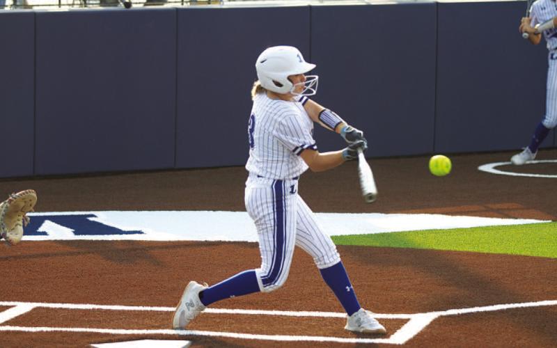 HUNTER KING | DISPATCH RECORD Brady Burton swings and hits one of her two home runs during the game against Jarrell on Tuesday.