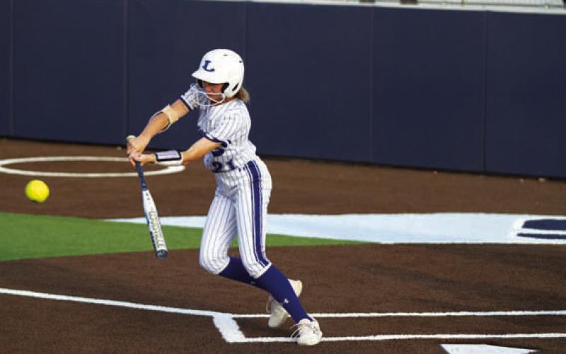Sagen Plouff slaps a ball the other way for a base hit. HUNTER KING | DISPATCH RECORD