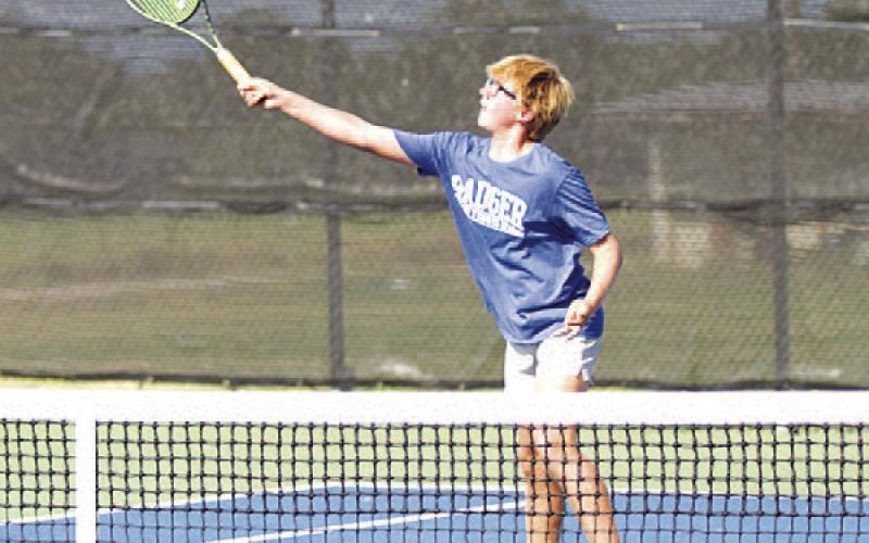 Jack Allison volleys the ball at the net against Glen Rose. HUNTER KING | DISPATCH RECORD