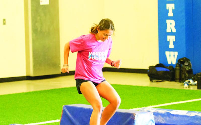 Chloe Thorp works through an agility drill Monday morning at SWAT. HUNTER KING | DISPATCH RECORD