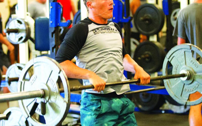 HUNTER KING | DISPATCH RECORD Corbin Kepler works through Monday’s weights before the program takes a break next week.