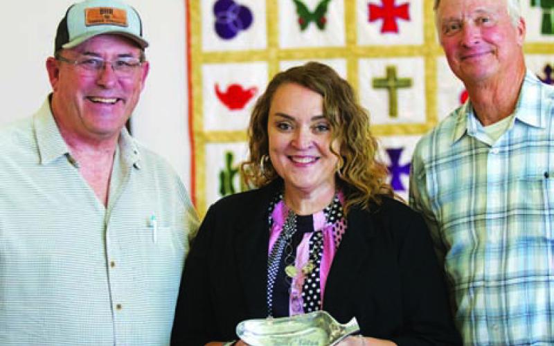 HUNTER KING | DISPATCH RECORD Delores Tower was the winner of the Sauciest Salsa Contest at this year’s County Fair. Mayor Herb Pearce, left, and County Judge Randy Hoyer were on hand to congratulate her.