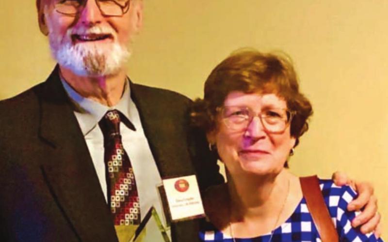 Steve Forsythe, shown with his wife, Cynthia, holds the Ag Education Hero Award he received from the Agriculture Teachers Association of Texas during the group’s annual summer convention. COURTESY PHOTO
