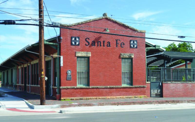 Austin businessman Rick Hardin had renovated the Santa Fe Depot and added several structures to the property in 2023. Now with new owners, the historic depot could see further development and become a railroad museum with a locomotive on display, a barbecue restaurant added and other features to make it a tourist destination. ERICK MITCHELL | DISPATCH RECORD