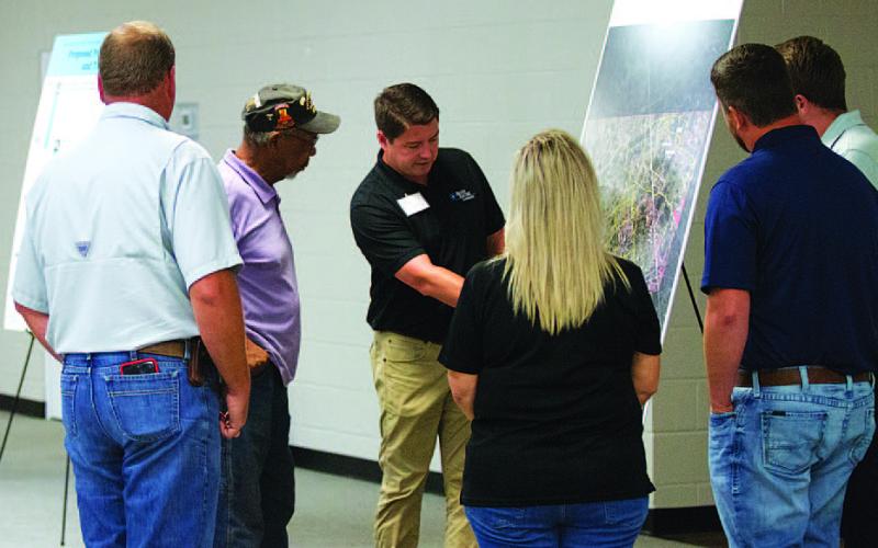 Representatives from Brazos Electric discuss plans for the Beecham Gap transmission line project with area residents at the Copperas Cove Civic and Conference Center on Aug. 6. HUNTER KING | DISPATCH RECORD