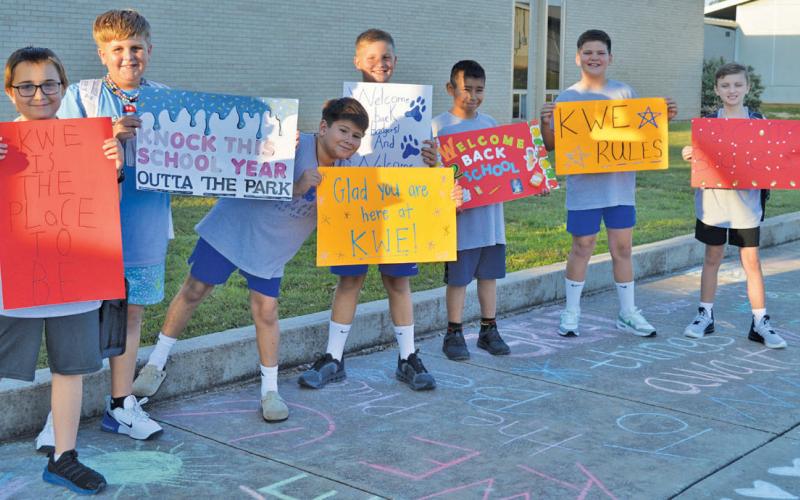 K-Kindness Kids from Kline Whitis Elementary made signs to welcome new students on the first day of school. The boys’ group shown here includes, from left to right, Noah Schwartzer, Alex Duran, Alex Torres, Alex Bobo, Adriel Mejia, Eli Dowdy and Jackson Darby. erick mitchell | dispatch record