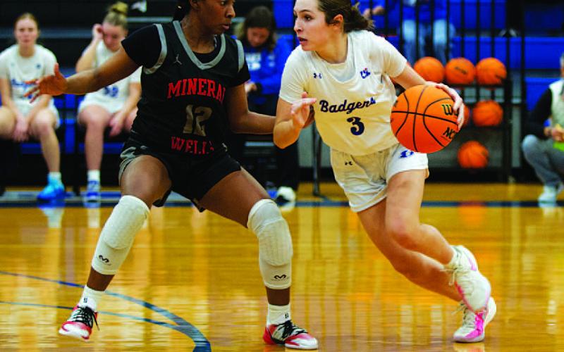 HUNTER KING | DISPATCH RECORD Kase Bumpus drives past a Mineral Wells defender during last Friday’s game.