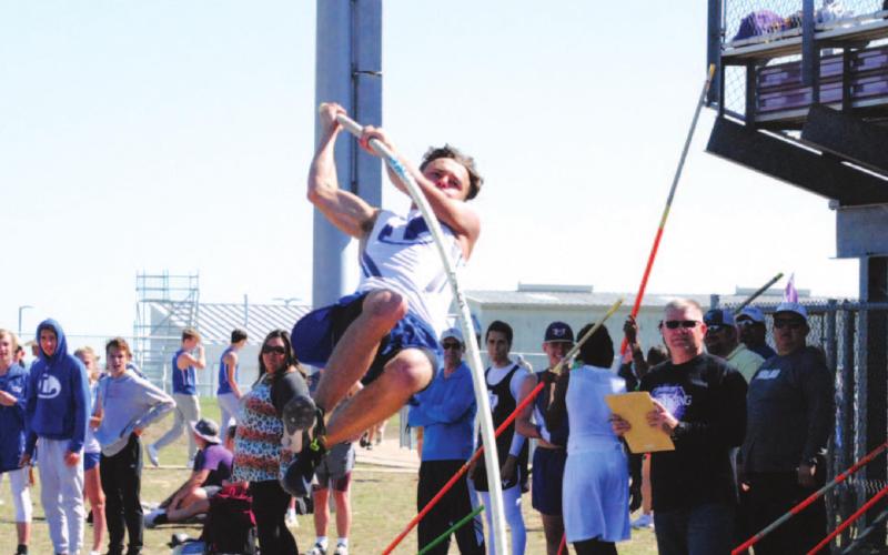 Wilson Hammond pulls himself up during pole vault at the Thrall track meet last Thursday. Hammond finished third overall. HUNTER KING | DISPATCH RECORD