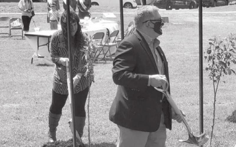 Lampasas City Secretary Becky Sims, left, participates in a tree-planting ceremony Thursday as part of an effort to continue making Central Texas a sustainable community. LAMPASAS.ORG | COURTESY PHOTO