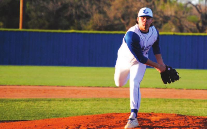 Tak Stinnett lets a pitch go during his complete game shutout of Brownwood earlier this season. HUNTER KING | DISPATCH RECORD