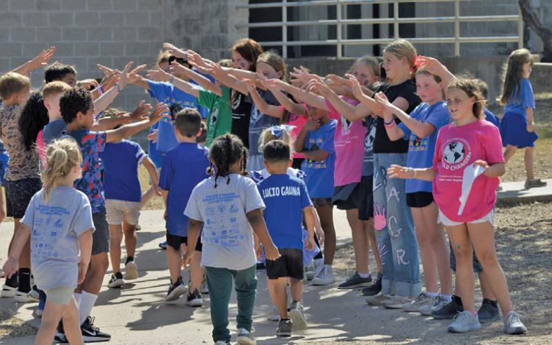 After Friday’s pep rally, students returned to class through a tunnel of praise from students who are part of the World Changers, a student leadership group on campus. Erick Mitchell | Dispatch Record