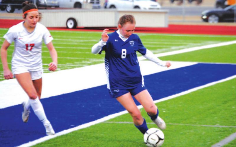 Nevaeh Stevens dribbles down the left side of midfield against Lake Belton last week. HUNTER KING | DISPATCH RECORD