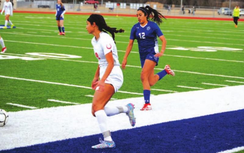Leilany Alvarez chases a Lake Belton player back toward her own goal. HUNTER KING | DISPATCH RECORD
