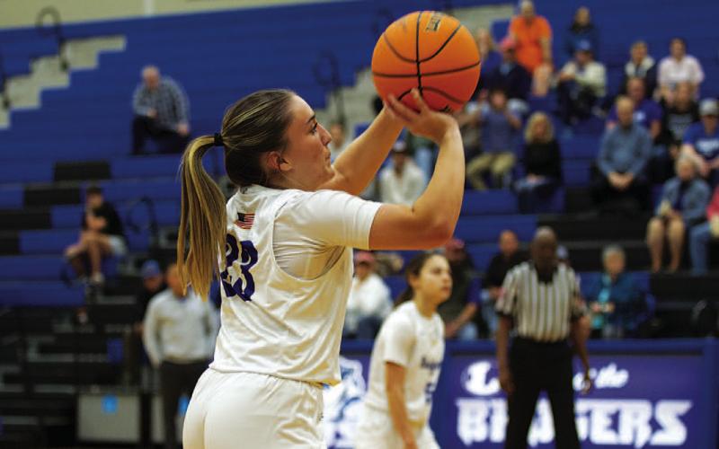 HUNTER KING | DISPATCH RECORD Payton Crawford releases a three-point shot. She scored 12 points in last week’s victory.