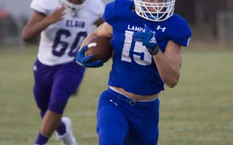 Case Brister sprints past the Elgin defense during the win Friday. HUNTER KING | DISPATCH RECORD