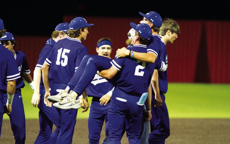 J.T. Posten (2) carries Calvin Phelps after the Badgers’ win over Salado on Tuesday. HUNTER KING | DISPATCH RECORD