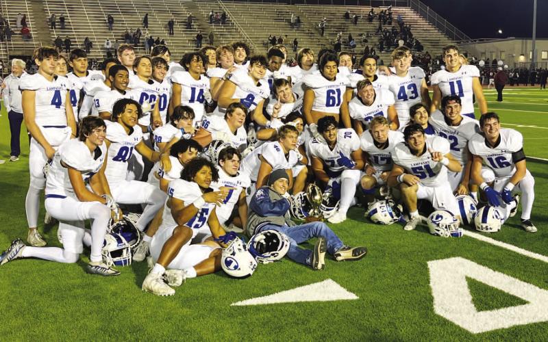 HUNTER KING | DISPATCH RECORD The Badgers pose with their bi-district trophy after last week’s win over Uvalde.