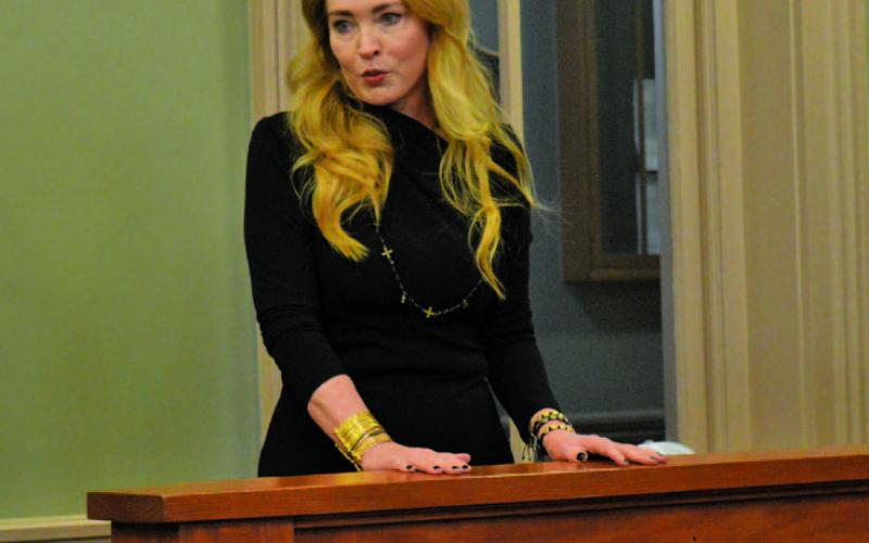 Michelle Wittenburg provides county officials with her career summary during Monday’s Lampasas County Commissioners Court meeting. The court approved a contract agreement with Wittenburg to provide lobbying services for the county. EERICK MITCHELL | DISPATCH RECORD