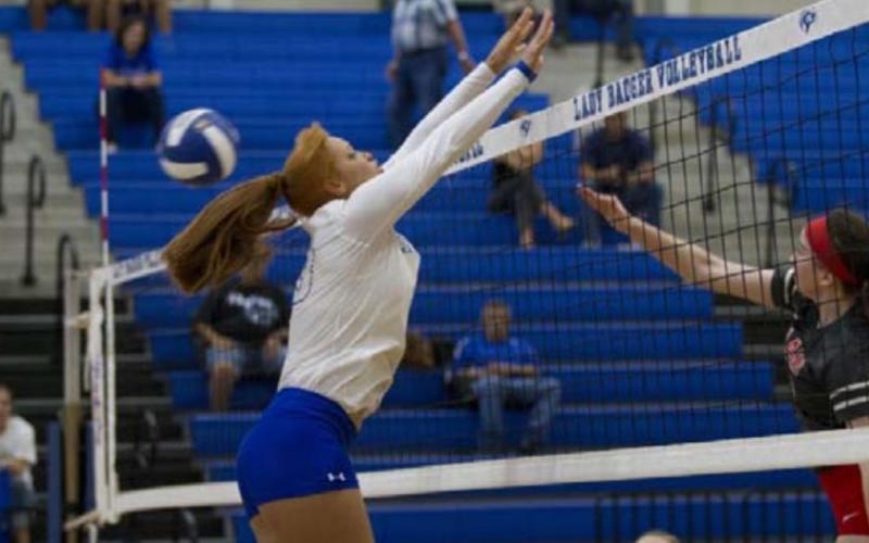 Juliana Dwamena goes up for a block against Lake Belton. HUNTER KING | DISPATCH RECORD