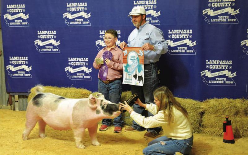 Ryker Shuffler showed the grand champion market swine at last Saturday’s livestock show. HUNTER KING | DISPATCH RECORD