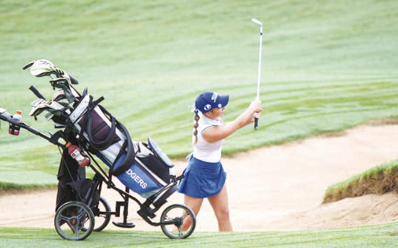 Kenlee Turner hits a bunker shot early in her second round. The junior finished 15th in the state as an individual. HUNTER KING | DISPATCH RECORD