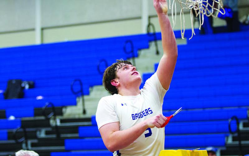 Aidan Nuckles and the Badgers got to cut down the nets after a district title this season. FILE PHOTO