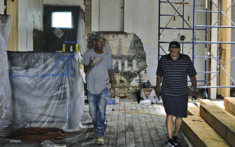 At left, Dwayne Friedlander of Holloman Masonry and Lampasas County Museum Foundation member Randy McGuire discuss repair efforts on the historic museum building. ERICK MITCHELL | DISPATCH RECORD