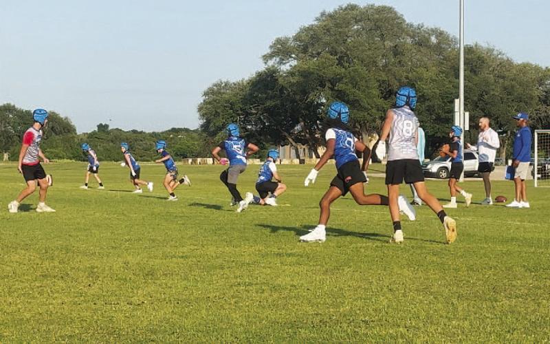 COURTESY PHOTO Fifth- and sixth-grade students run routes and play defense during 7-on-7 in May.
