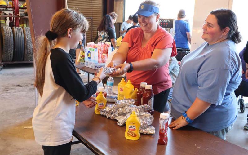 The Lometa Lions Club served hot dogs and popcorn to those attending the National Night Out at the Lometa Fire Station Tuesday evening. Pictured, from left, are Cheyenne Butler, Stephanie Boyer and Holly Hines. CHERI WIENECKE | DISPATCH RECORD