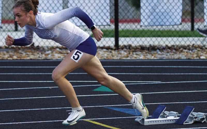 HUNTER KING | DISPATCH RECORD Teagan Reiss gets out of the blocks for her 400-meter race.