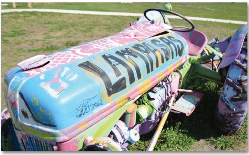 Sculpture garden a good place for a walk After rain moved through the area this week, sunny skies returned and brought moderate winter temperatures, just right for a brisk walk outside. A stroll through the Hanna Springs Sculpture Garden shows this brightly painted tractor bearing the city’s name. MONIQUE BRAND | DISPATCH RECORD