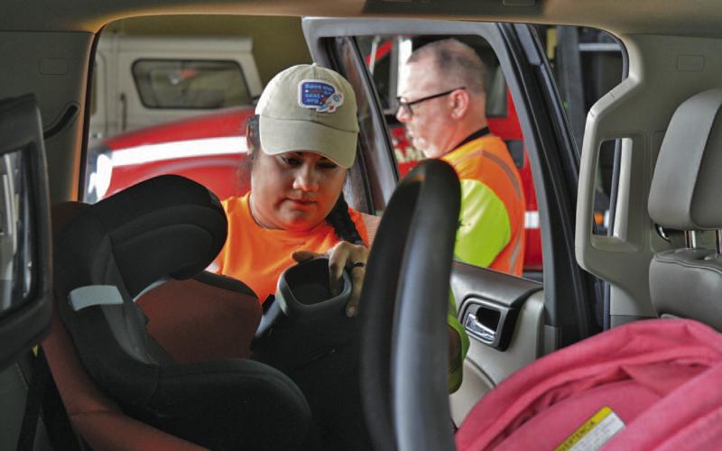 Texas Department of Transportation-certified child passenger safety technicians ensured each child car seat was installed correctly during Thursday’s event at the Lampasas Fire Department Station on Fourth Street. ERICK MITCHELL | DISPATCH RECORD