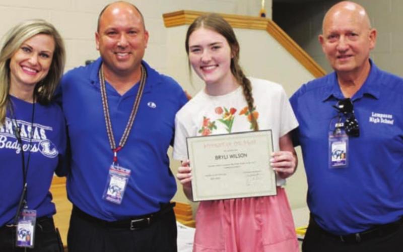 Bryli Wilson center, is pictured with LHS Assistant Principal Donna LeJeune, Assistant Principal Paul Weinheimer and Principal Joey McQueen, left to right. COURTESY PHOTO